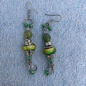 Silver and green glass drop earrings.