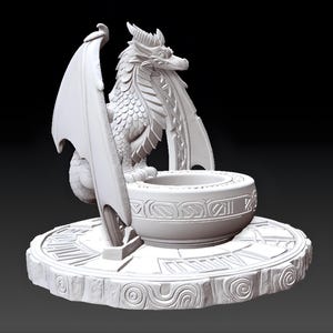May include: A detailed, white dragon sculpture with outstretched wings, perched beside a decorative bowl. The dragon is intricately designed with scales and horns, set on a round base with carved patterns. The sculpture is a fantasy-themed decorative item.