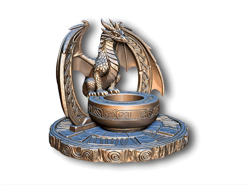 May include: Bronze-colored dragon sculpture with intricate details. The dragon has large wings and sits atop a round base with a bowl-like structure in the center. The base and bowl feature engraved patterns. A fantasy-themed decorative item.