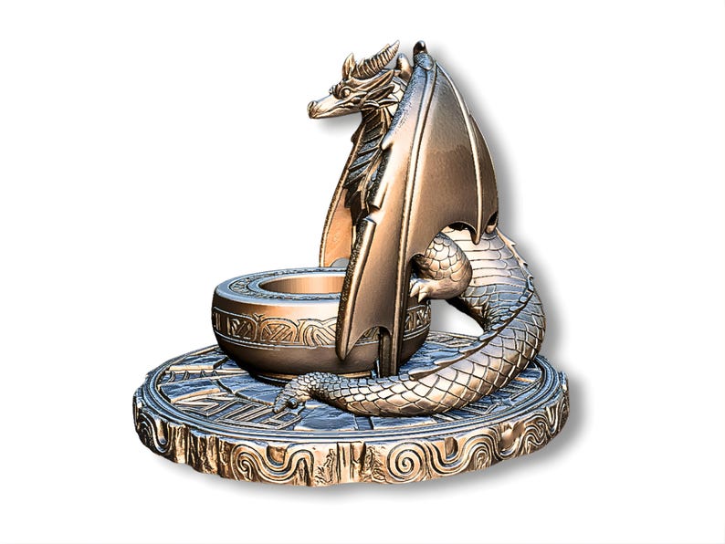 May include: Bronze dragon sculpture with intricate details. The dragon has outstretched wings and is coiled around a bowl-shaped structure. The base is circular with ornate patterns. A decorative piece.