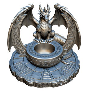 May include: A silver-colored dragon sculpture with outstretched wings, perched above a circular bowl. The dragon has detailed scales and horns. The base features a circular design with engraved patterns, creating a fantasy theme.