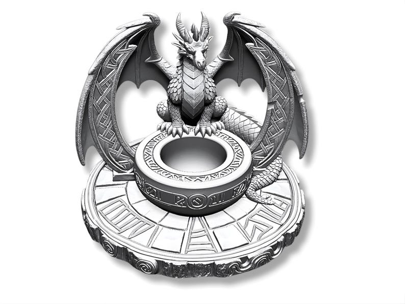 May include: A detailed, silver-colored dragon sculpture. The dragon has large wings with intricate patterns, and it sits atop a circular base with a central opening. The base has a geometric design.