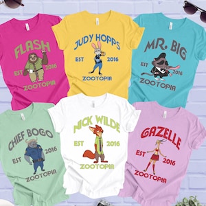 a collection of T-shirts featuring characters from the animated movie "Zootopia", including a sloth, a rabbit, and other animals. The shirts are arranged in a grid-like pattern, with each shirt featuring a different character and the year "2016" printed on it.