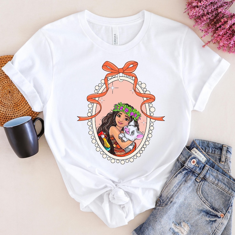 a white shirt with a picture of a woman holding a cat