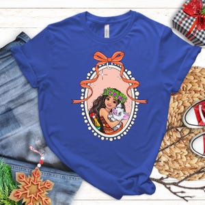 a t - shirt with a picture of a woman holding a baby