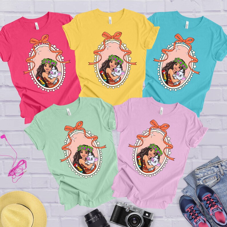 a group of four t - shirts with cartoon characters on them