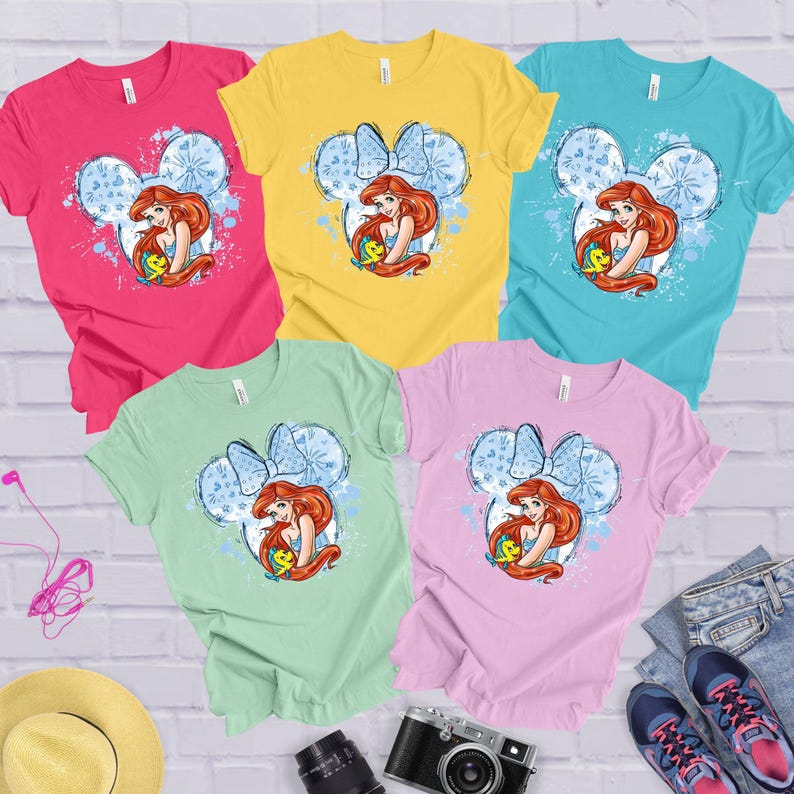 a group of four t - shirts with the little mermaid on them