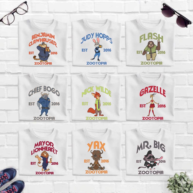 a collection of nine white t-shirts with various cartoon animal characters and text, arranged in a 3x3 grid on a white brick wall.