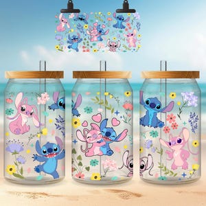 three glass jars with colorful and whimsical designs, including cartoon characters and floral patterns.