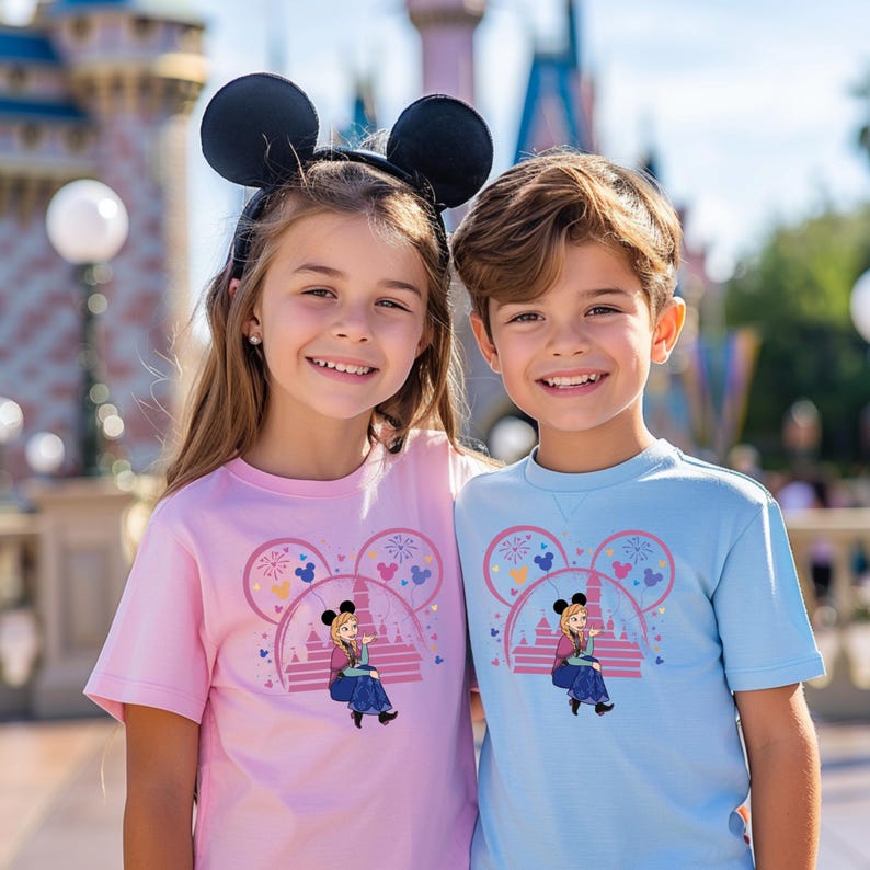 two young girls standing next to each other in front of a castle