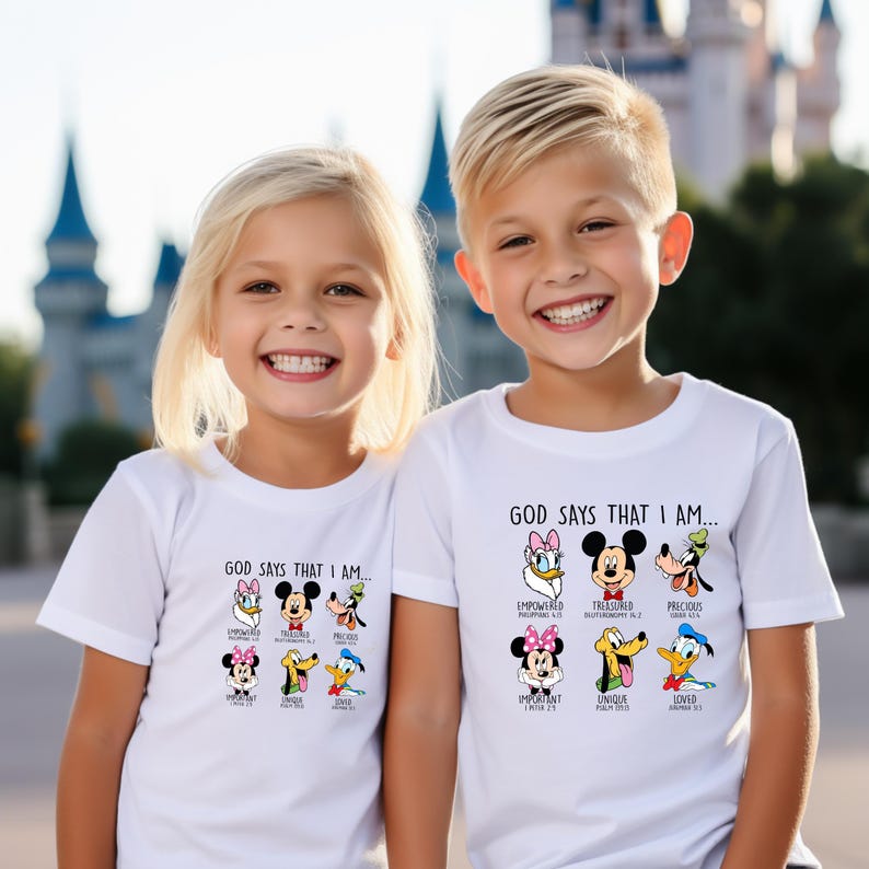 two young children standing next to each other in front of a castle