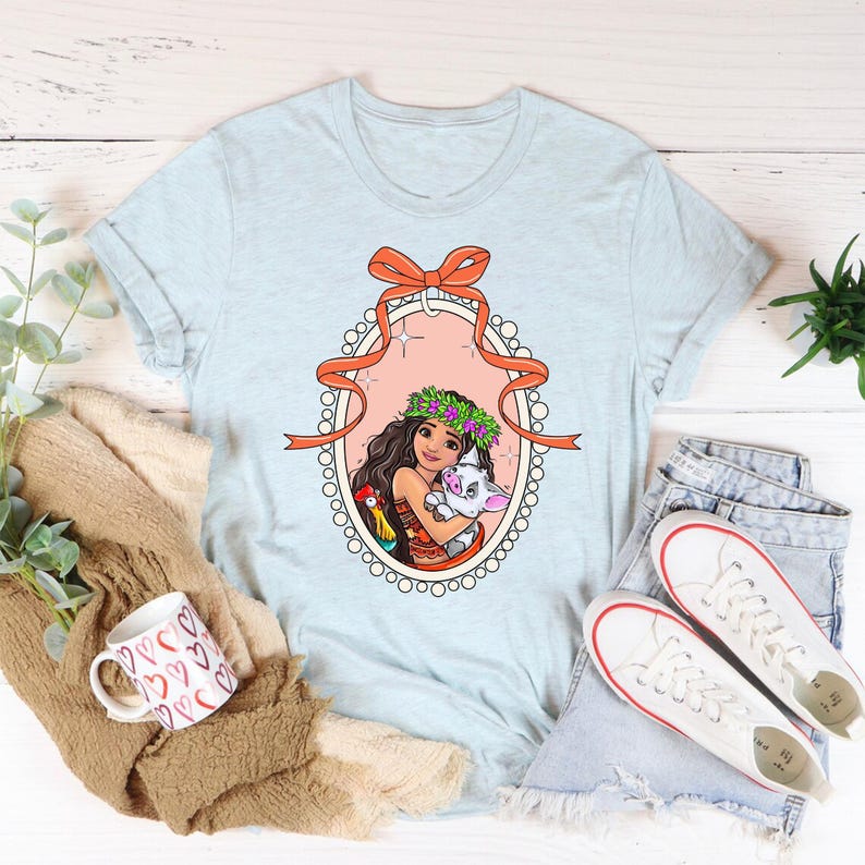 a t - shirt with a picture of a woman holding a cat