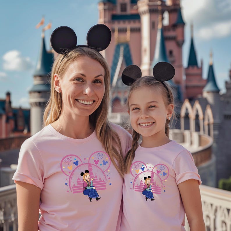 a woman and a little girl standing in front of a castle