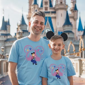 a man and a young boy standing in front of a castle