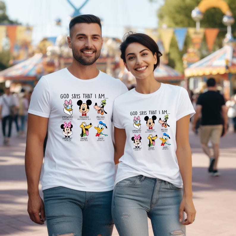 a man and a woman wearing mickey mouse shirts