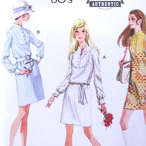 May include: McCall's vintage 60's sewing pattern featuring three dress designs. The pattern includes additional size options and cutting layouts. The image shows illustrations of the dresses, with the text "AUTHENTIC" and "Designed and printed in USA".