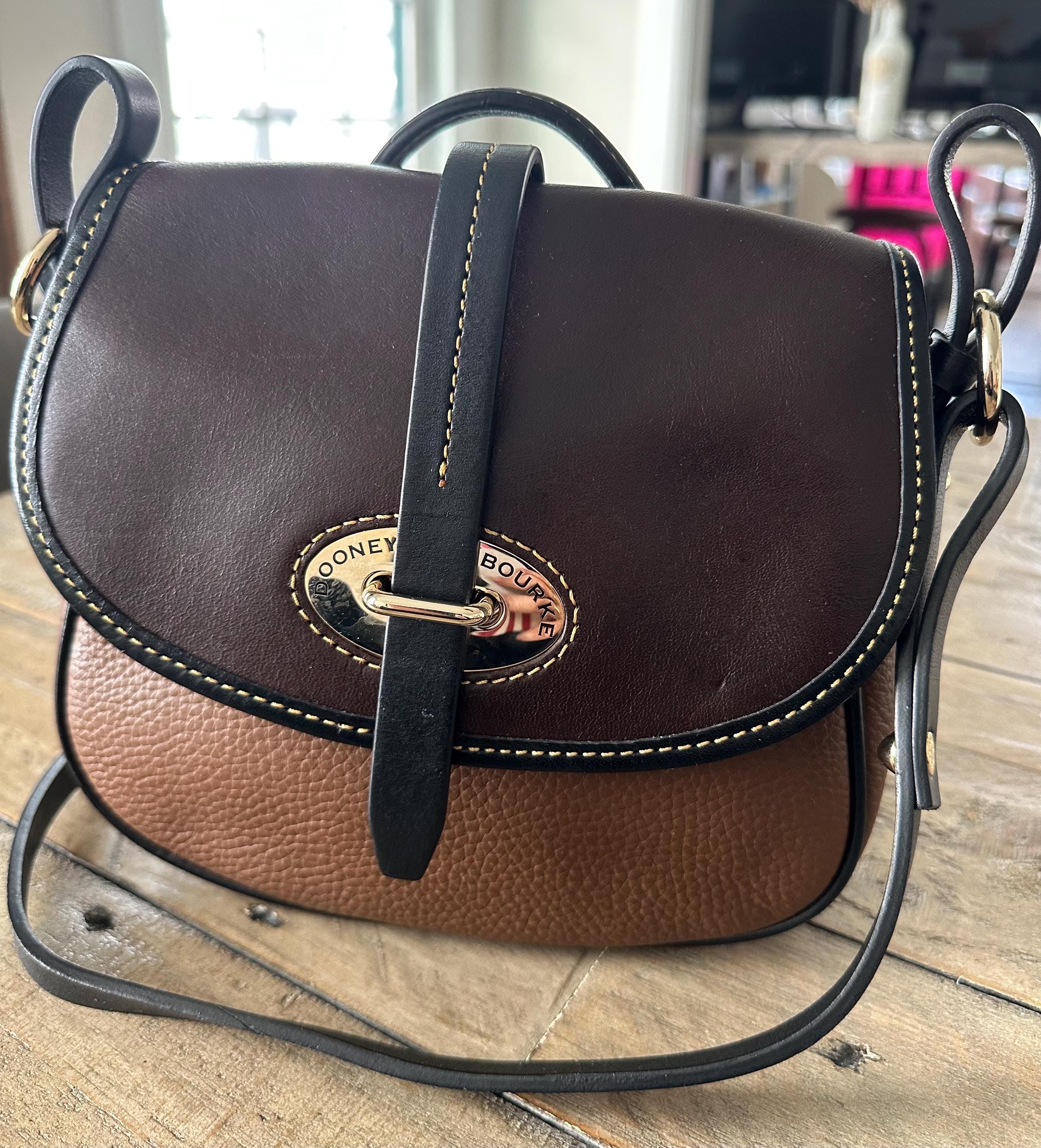 Dooney & Bourke All Weather Leather  flap Saddle Bag