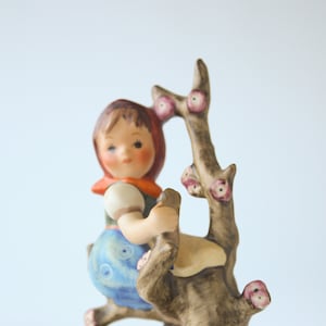 Vintage 1960s TMK 3 Hummel figurine "Apple Tree Girl" featuring girl in apple tree