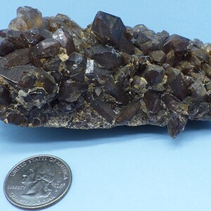 Quartz Crystal Cluster with Red Hematite Inclusions from Orange River South Africa.
