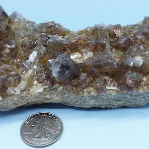 Quartz Crystal Cluster with Red Hematite Inclusions from Orange River South Africa.