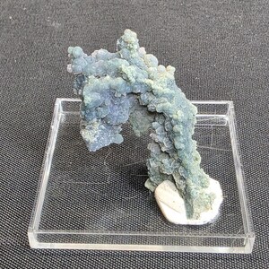 May include: A set of three ceramic mugs with a speckled, matte finish. The mugs are in shades of cream, light grey, and dark grey. Each mug has a simple, minimalist design, ideal for coffee or tea.