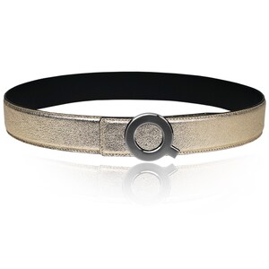 May include: A gold leather belt with a black metal buckle shaped like the letter Q.