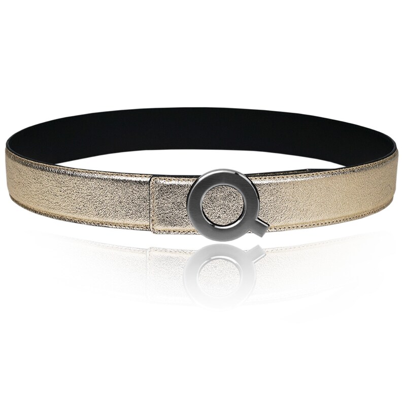 May include: A gold leather belt with a black metal buckle shaped like the letter Q.