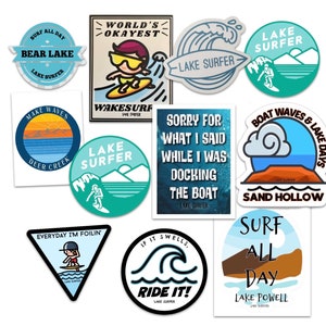May include: A set of ten colorful stickers featuring lake-themed illustrations and text. The stickers include phrases like "Surf All Day", "World's Okayest", "Lake Surfer", "Make Waves", "Boat Waves & Lake Days", "Everyday I'm Foilin', "If It Swells, Ride It!" and "Surf All Day".