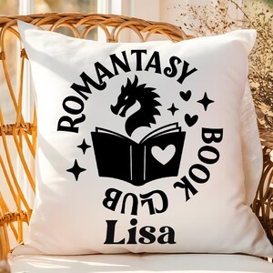 May include: White pillow with black text that reads "Romantasy Book Club Lisa" with a black dragon and open book graphic.