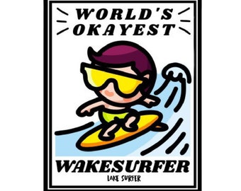 May include: A cartoon illustration of a person wearing yellow sunglasses and a purple shirt riding a surfboard on a wave. The text "WORLD'S OKAYEST WAKESURFER LAKE SURFER" is printed on a black and white frame.