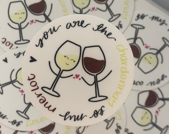 May include: A collection of round stickers featuring cartoon wine glasses. One glass is filled with white wine, the other with red. Text reads "You are the Chardonnay to my Merlot."