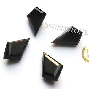 May include: Four black kite-shaped gemstones with faceted surfaces arranged in a cluster. The text DSGEMSTONE is visible in the upper right, and a gold logo with the letters DS and the word GEMSTONE Handmade is in the lower right corner.