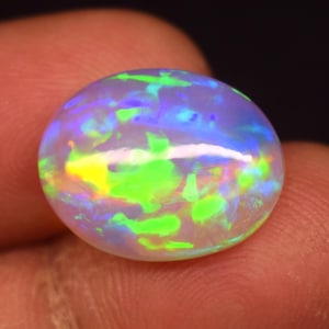 AAAA++ 100% Natural Top Quality Ethiopian White Opal Gemstone Natural Multi Fire Opal Oval Shape Cabochon White Opal Are Making Jewelry.