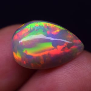 Natural Ethiopian Multi Fire 8.8 Carat Shape Pear Opal Gemstone Cabochon Size 18.1X11.7X9.5MM