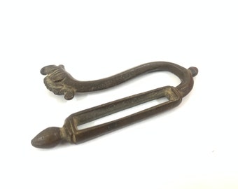 Antique brass belt hook for gunpowder flask with Bird Face