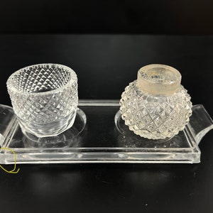 May include: A clear glass tray with two small, clear glass containers with a diamond pattern. The containers are for ink or other liquids.