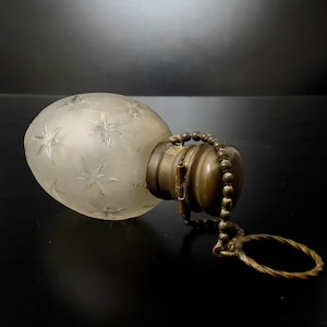 Vintage Egg Shaped perfume bottle with ring chain and beautiful engraving on body