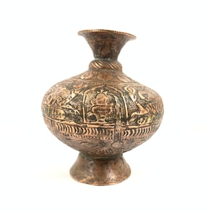 May include: An antique copper vase with intricate etched designs. The vase has a round body and a narrow neck.