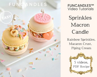 May include: Two colorful macaron candles with sprinkles and frosting. The candles are on a white plate with sprinkles scattered around them. The image includes the text "FUNCANDLES™ Video Tutorials" and "Sprinkles Macron Candle".