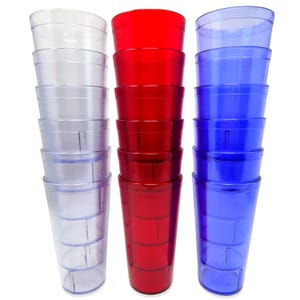 May include: A stack of clear, red, and blue plastic tumblers. Each stack contains several identical, ribbed, tall glasses. The clear glasses are on the left, the red glasses are in the middle, and the blue glasses are on the right.
