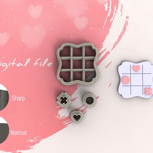 May include: A set of five cookie cutters in a light grey colour. The cutters are shaped like a heart, a circle, a cross, a noughts and crosses board, and a square with a grid pattern. The cutters are on a pink background with hearts.