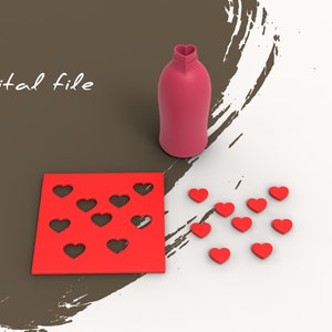 May include: A red silicone mould with nine heart-shaped cut-outs.  There are nine red heart-shaped silicone pieces scattered on a white surface.  The text "Digital file" is written in black on a brown background.