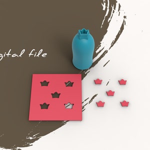 May include: A red square with five crown-shaped cutouts. There are six individual red crowns scattered around the square. A blue crown-shaped bottle stopper is in the top right corner of the image. The text "Digital file" is in the top left corner of the image.