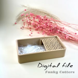 May include: A beige plastic tray with a patterned divider. The tray is filled with white powder. The text "Digital file Funky Cutters" is written below the tray.