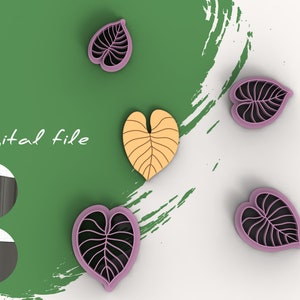 Könnte beinhalten: Digitaler Dateidownload von fünf blätterförmigen Ausstechern. Vier sind rosa mit schwarzen Adern und einer ist gelb mit orangefarbenen Adern. Die Ausstecher sind auf einem weißen Hintergrund mit einem grünen Hintergrund dahinter angeordnet.