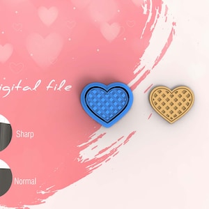 Könnte beinhalten: Digitale Datei für einen 3D-gedruckten herzförmigen Ausstecher mit Waffelmuster. Der Ausstecher ist in Blau und Braun dargestellt. Das Bild zeigt auch eine Nahaufnahme der scharfen und normalen Kanten des Ausstechers.