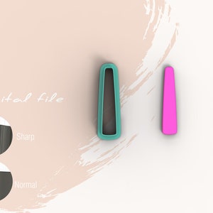 Könnte beinhalten: Zwei Ausstecher, einer türkis und einer rosa, in Form eines hohen, dünnen Rechtecks. Der türkisfarbene Ausstecher hat eine leicht abgerundete Ober- und Unterseite. Der rosa Ausstecher hat eine gerade Ober- und Unterseite. Die Ausstecher befinden sich auf einem weißen Hintergrund mit einem hellrosa Pinselstrich im Hintergrund.