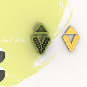 Puede incluir: Archivo digital para un cortador de galletas impreso en 3D en forma de V con un triángulo en la parte superior. El cortador se muestra en verde y amarillo.