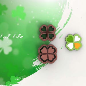 以下が含まれることがあります： 三つ葉のクッキーカッターが3つ。2つは茶色で、1つは緑、白、オレンジ色です。背景は緑と白のグラデーションで、「Digital file」の文字が入っています。