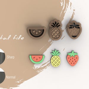 May include: Six cookie cutters in the shape of fruit: watermelon, pineapple, and strawberry. The cutters are brown, green, yellow, and red.